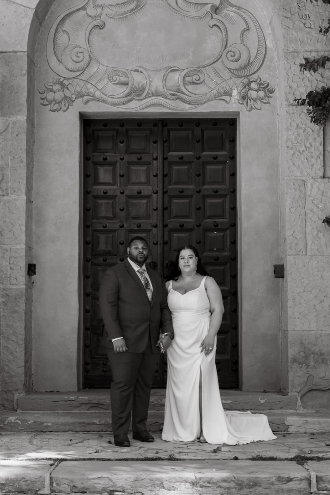 Portrait at the dark carved doors