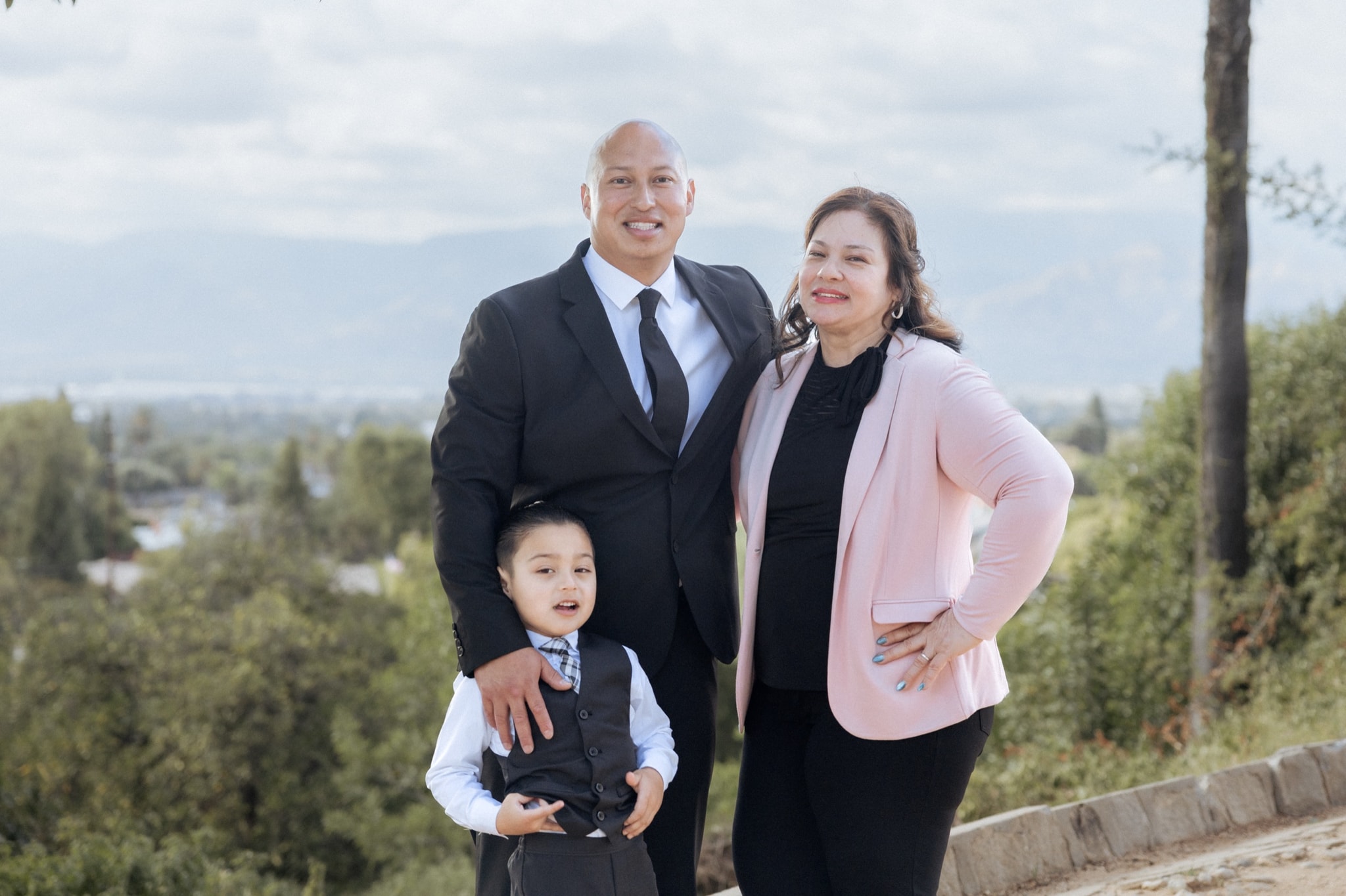 Three-generation family portrait at a Riverside hilltop