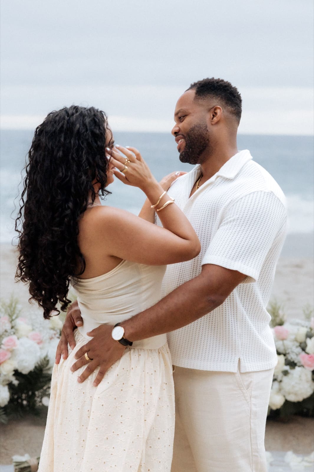 Her hands on his shoulders, close
