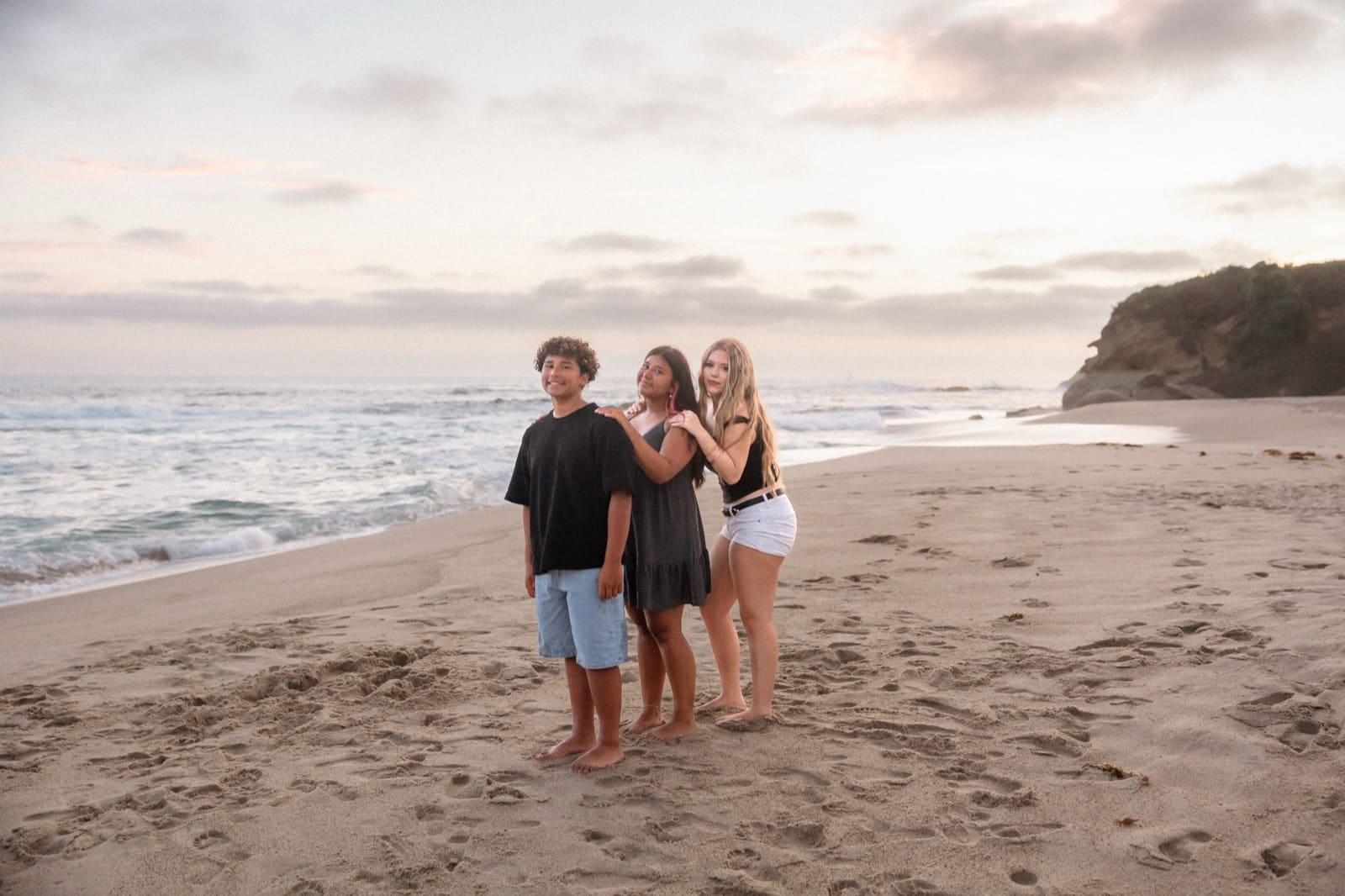 Family of four at the water's edge, Laguna