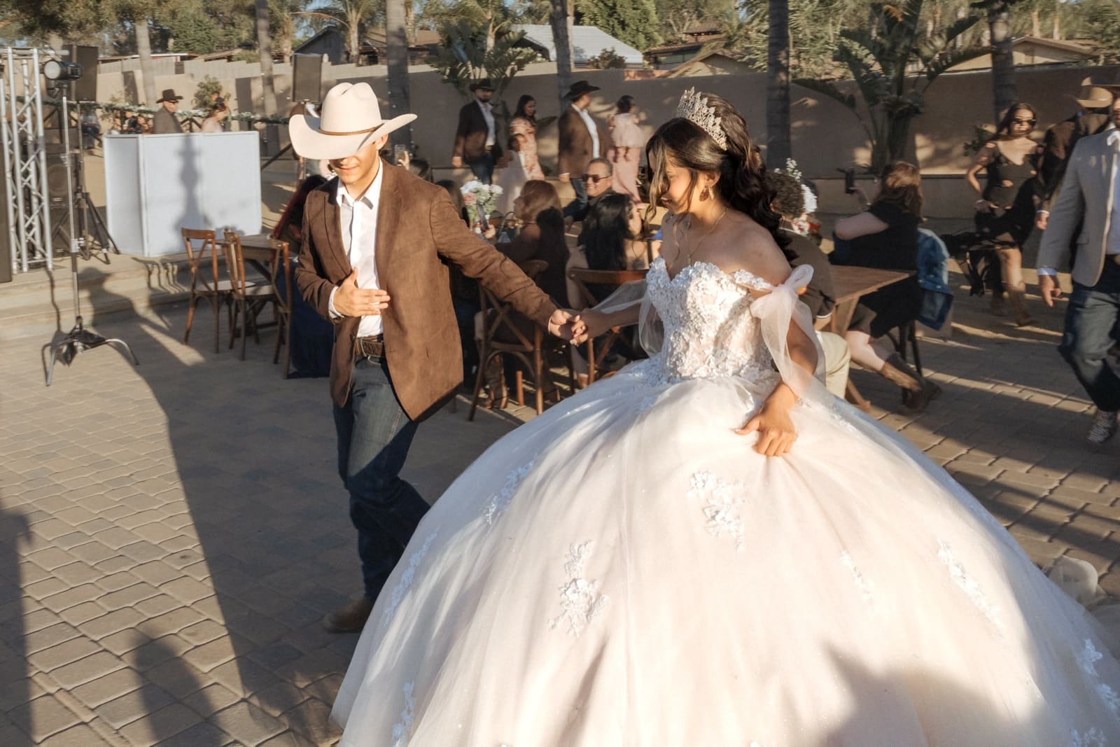 The father walks his daughter in, guests behind