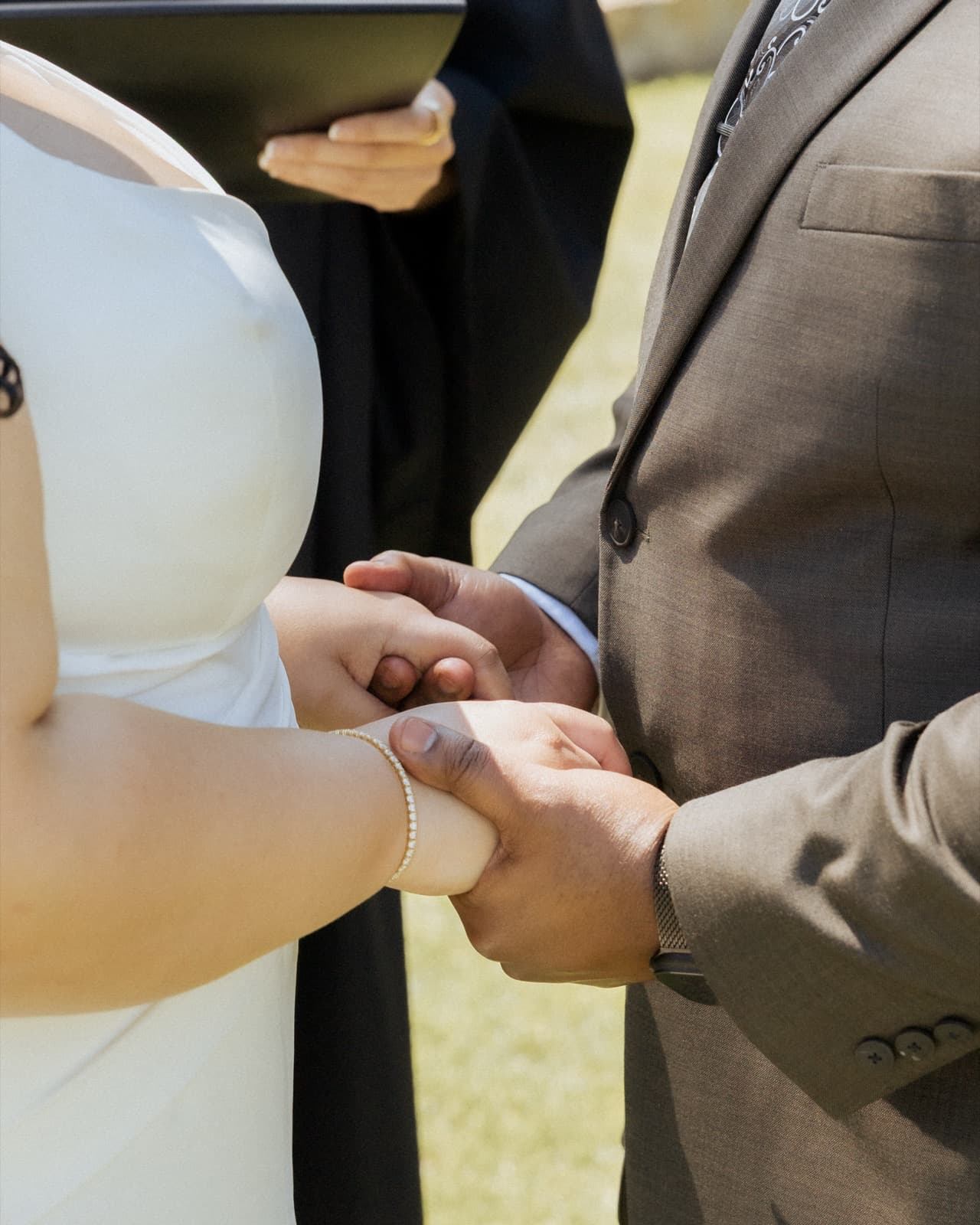 Ring detail — hands after the ceremony